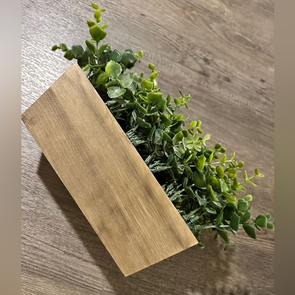 Fake plant with wooden planter